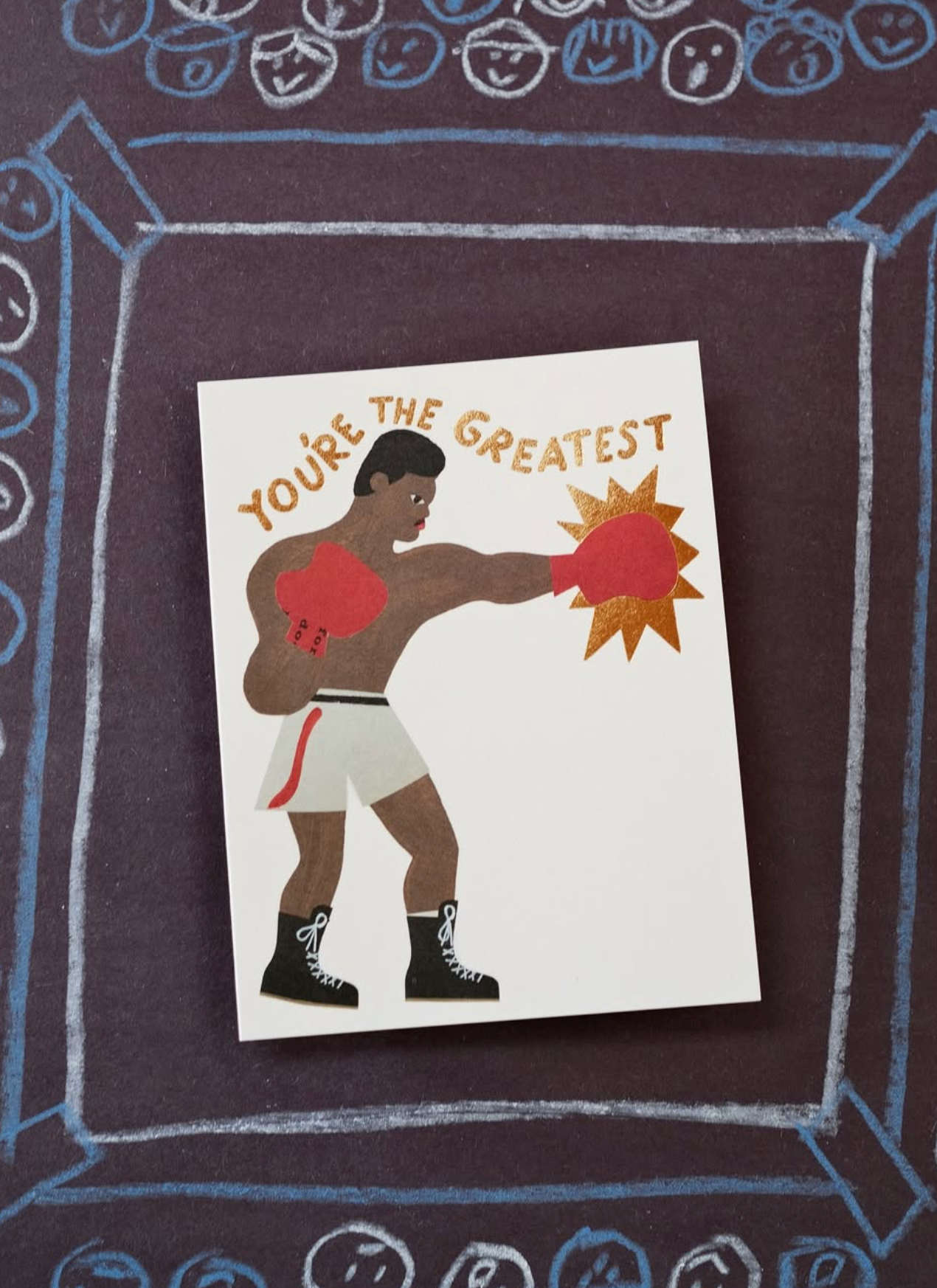 Illustration of a boxer with 'You're the Greatest' text on a decorative background