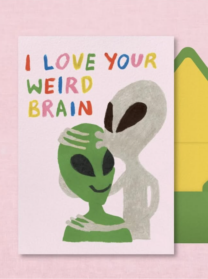 Card with alien design and 'I love your weird brain' text on a pink background