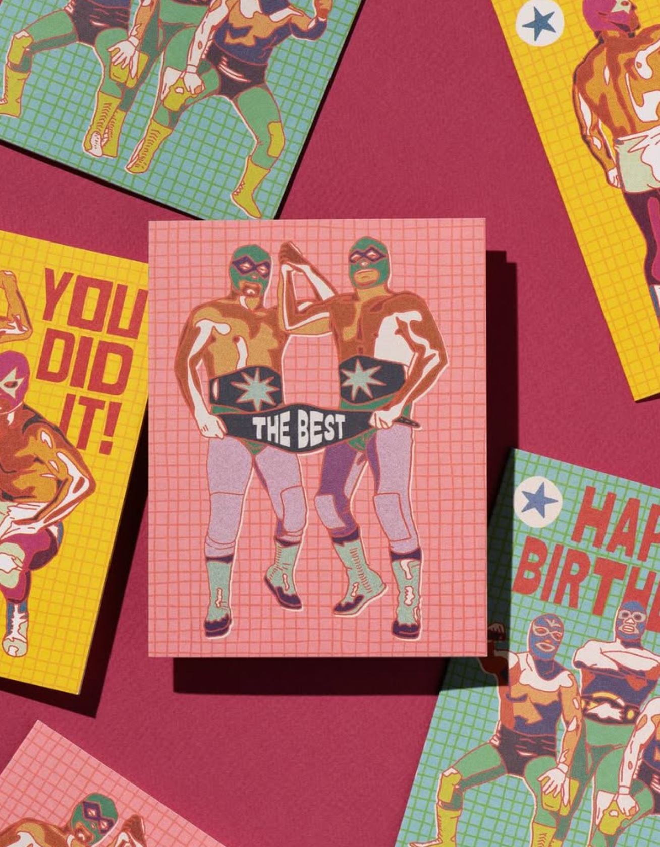 Collection of greeting cards with superhero designs on a red background