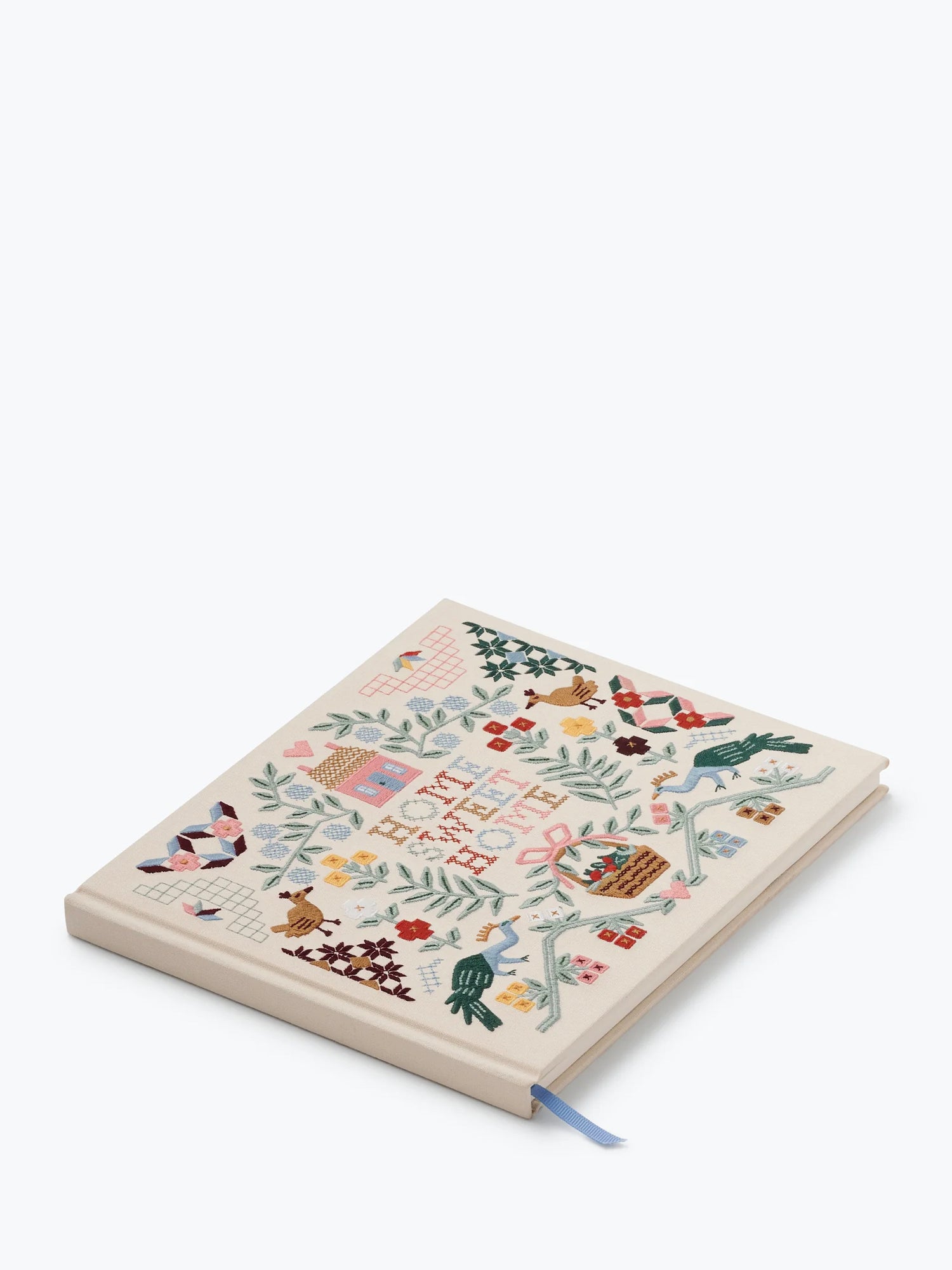 Guestbook with floral and nature-themed design on a white background