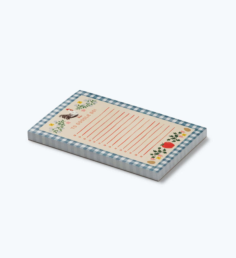 Notepad with checkered border and printed design on a white background