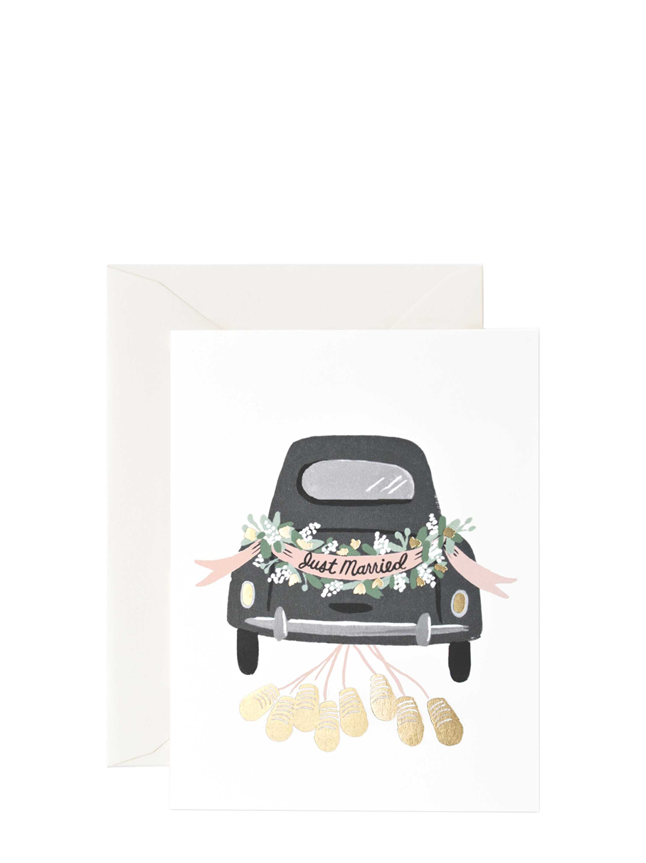 Decorative card with a black car and 'Just Married' sign on a white background