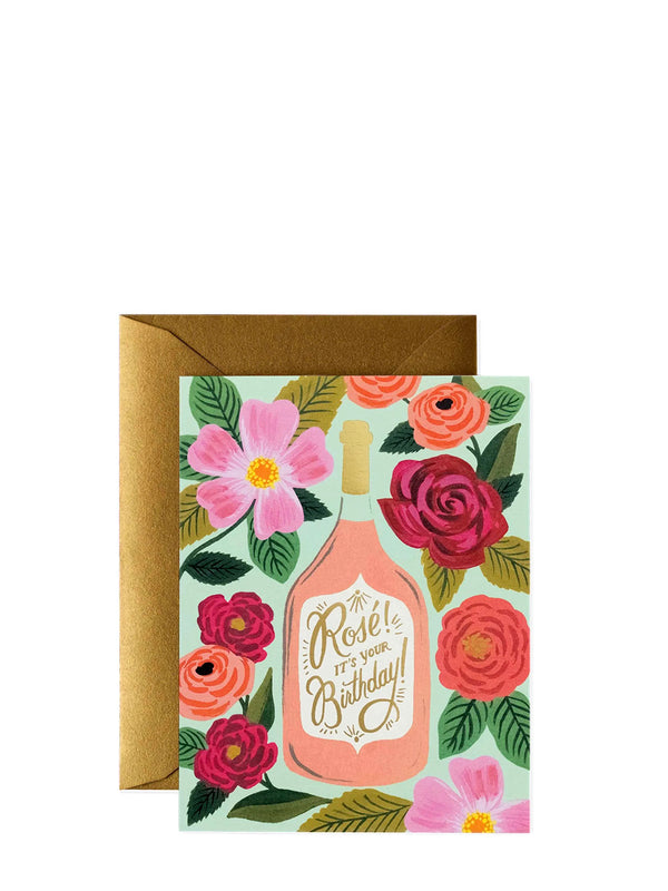 Greeting card with floral design and bottle illustration on a white background
