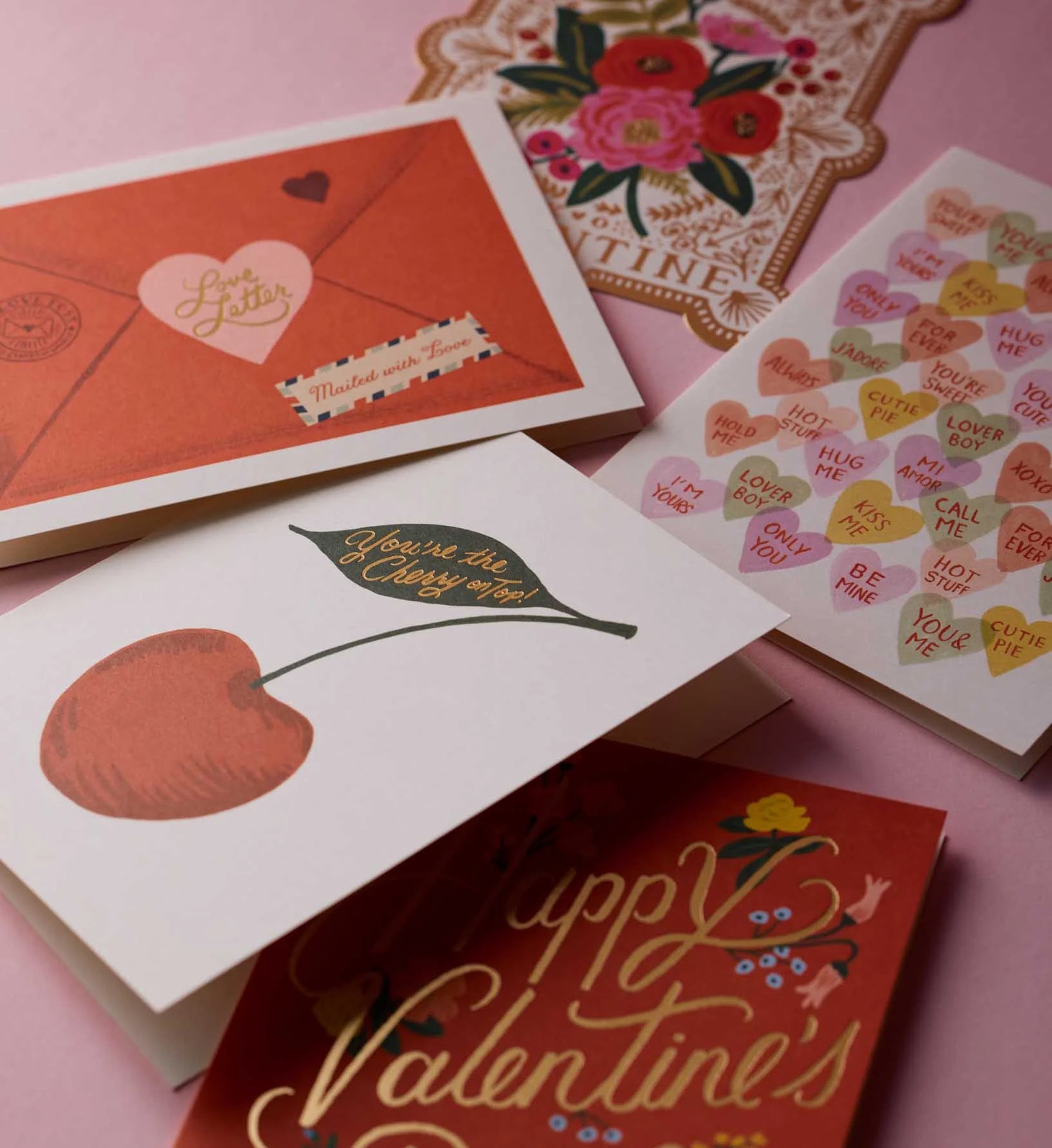 Collection of love cards on a pink background