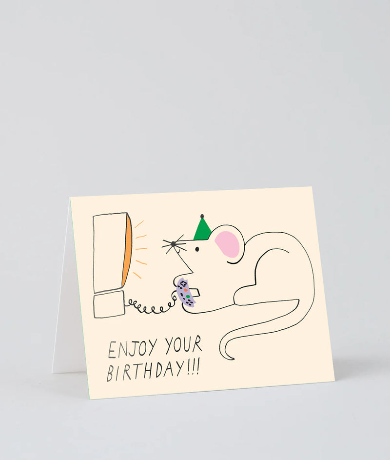 Birthday card with a cartoon mouse playing video game and text 'Enjoy your birthday!!!' on a light gray background