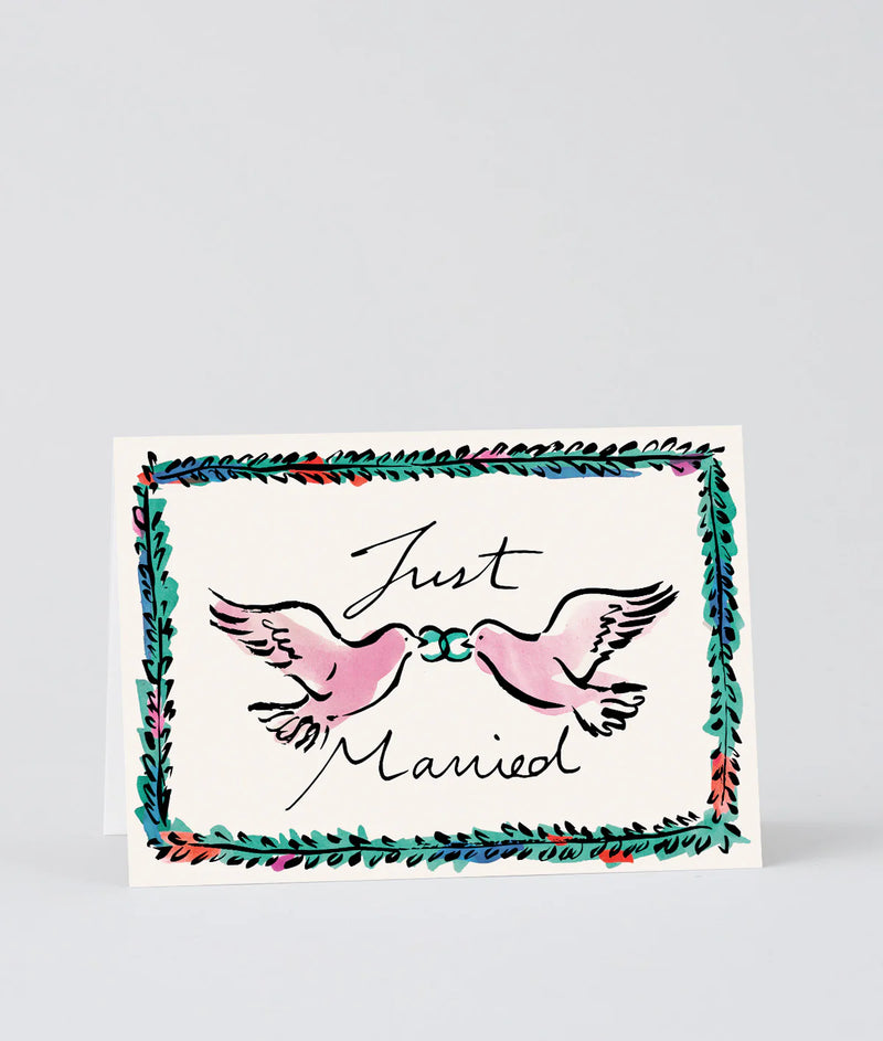 Card with two pink doves holding a ring and the text 'Just Married' on a light gray background.