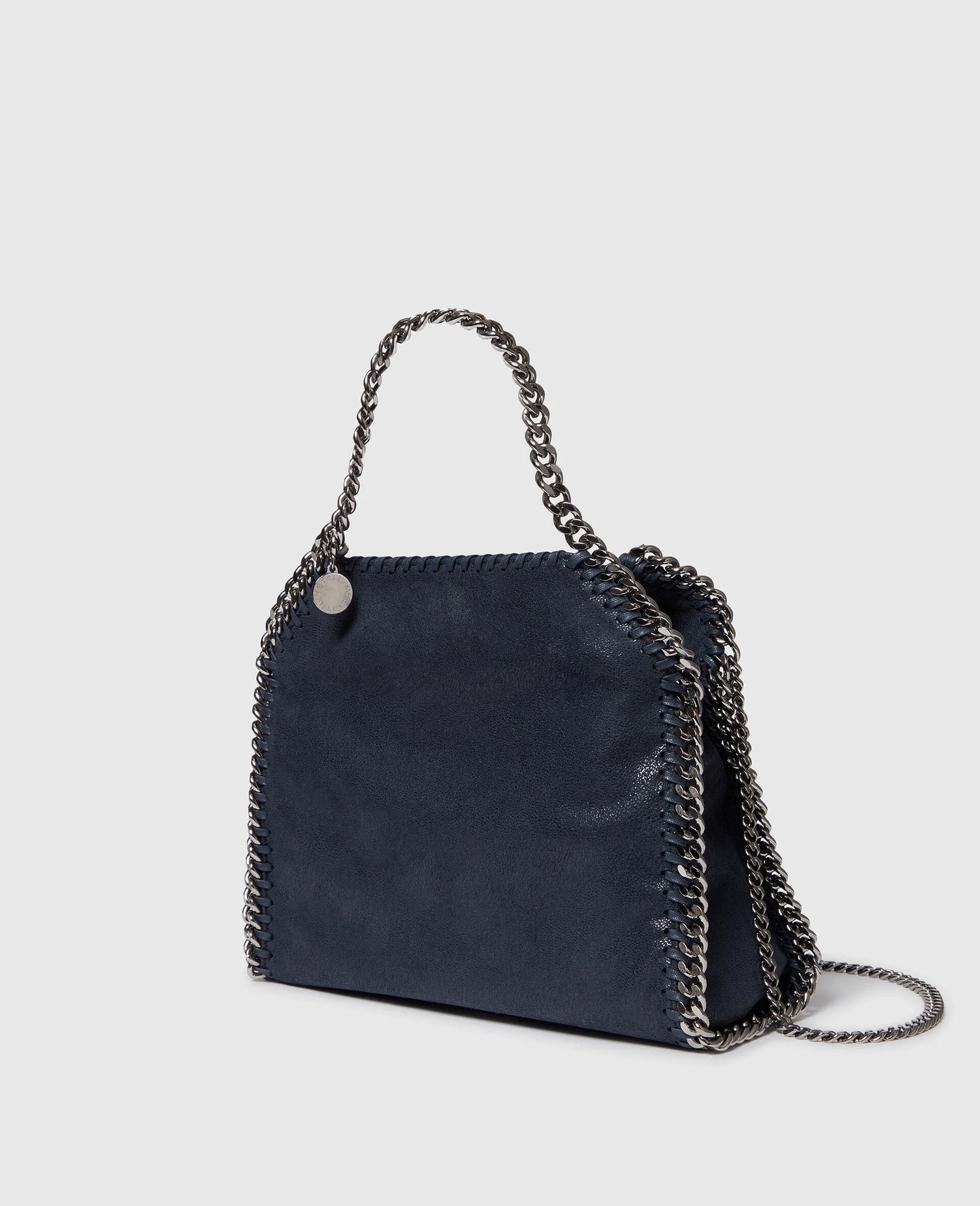 Dark blue handbag with chain detail on a light gray background