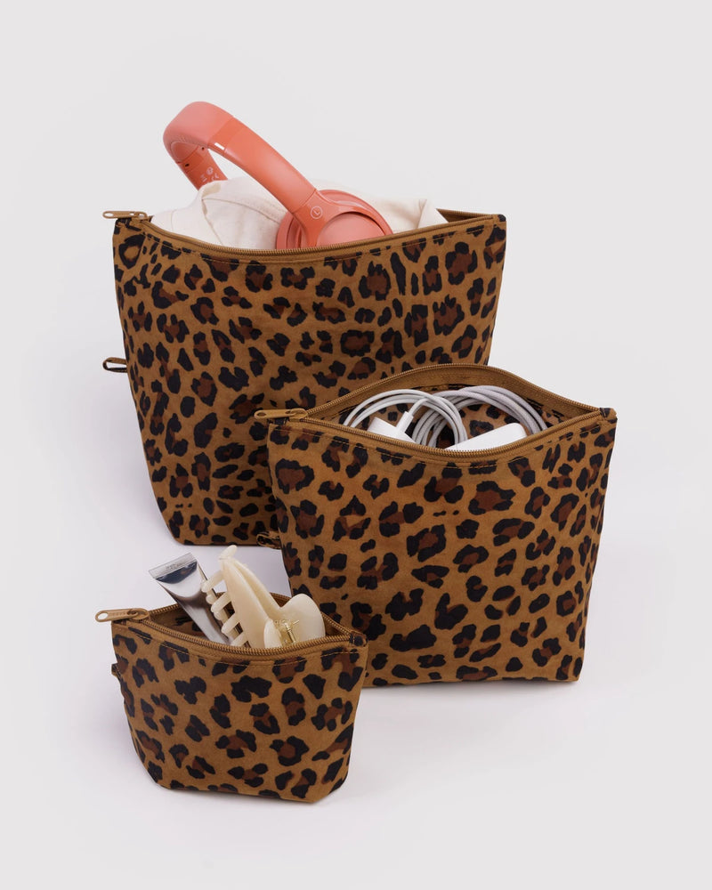 Set of leopard print bags on a white background