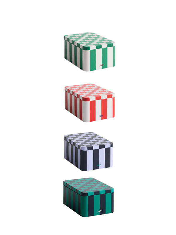 Set of four stacked boxes with checkered patterns on a white background