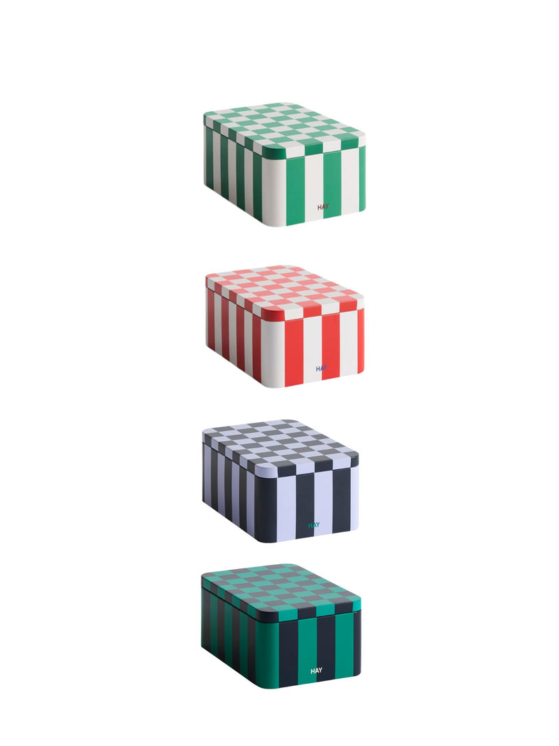 Set of four stacked boxes with checkered patterns on a white background