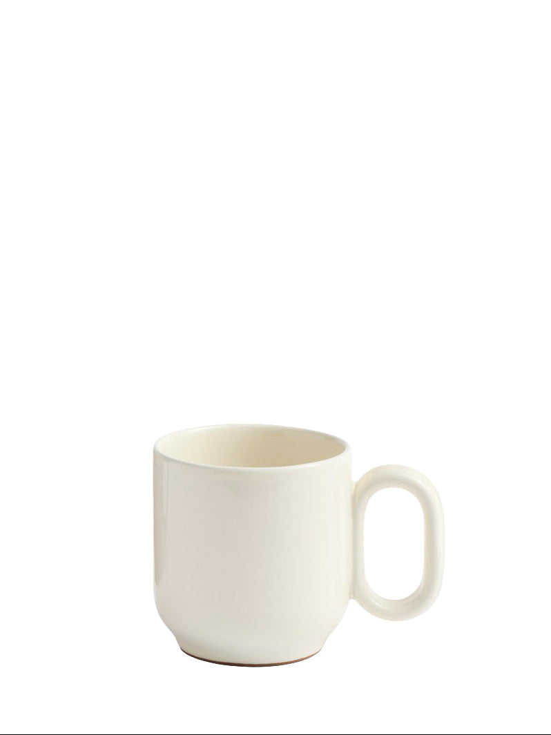 A minimalist off-white ceramic mug with a rounded body and a unique rectangular loop handle, shown against a solid white background.