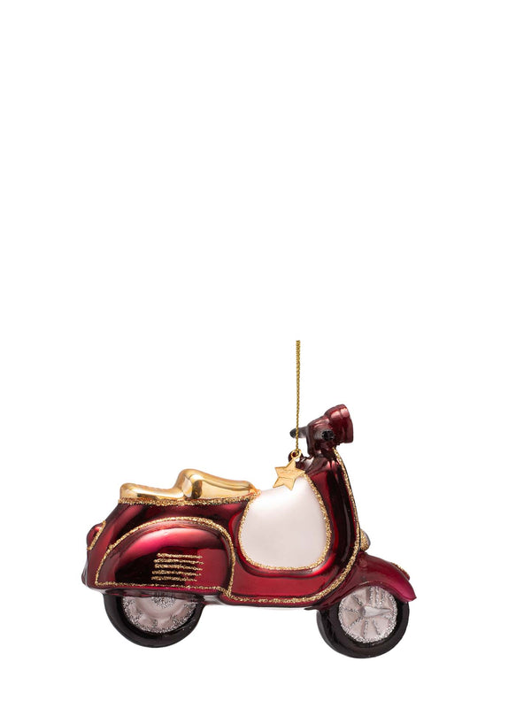 A decorative Christmas ornament shaped like a red and gold scooter or vespa with a white side panel and a gold hanging string, shown against a plain white background.