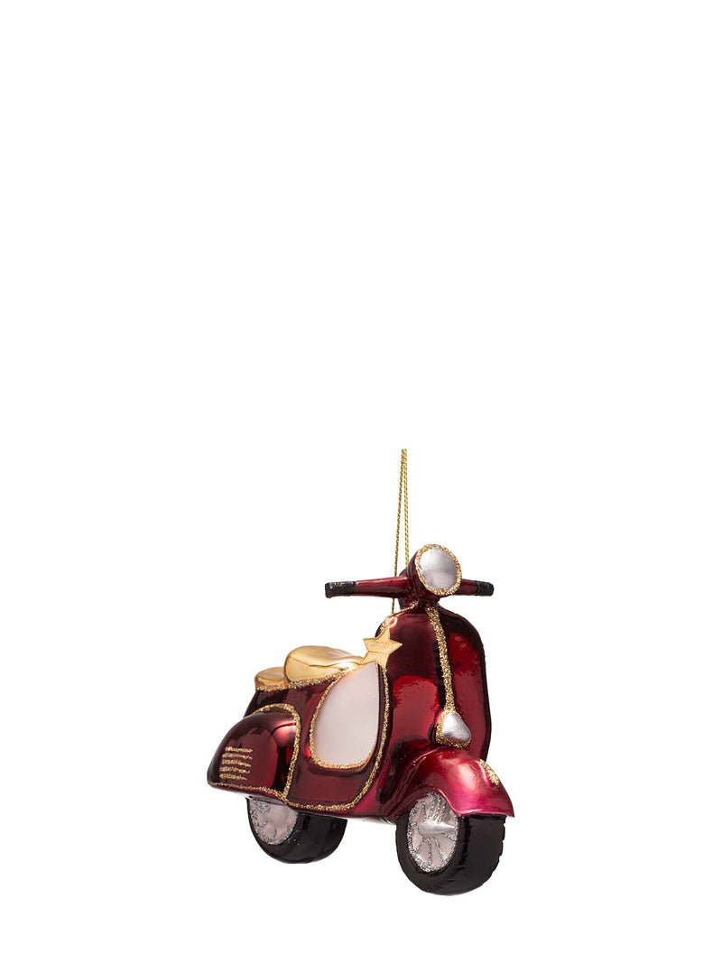 A decorative hanging ornament shaped like a retro scooter or vespa, featuring a metallic deep red body with gold trim, a cream-colored front panel, and black wheels, shown against a plain white background.