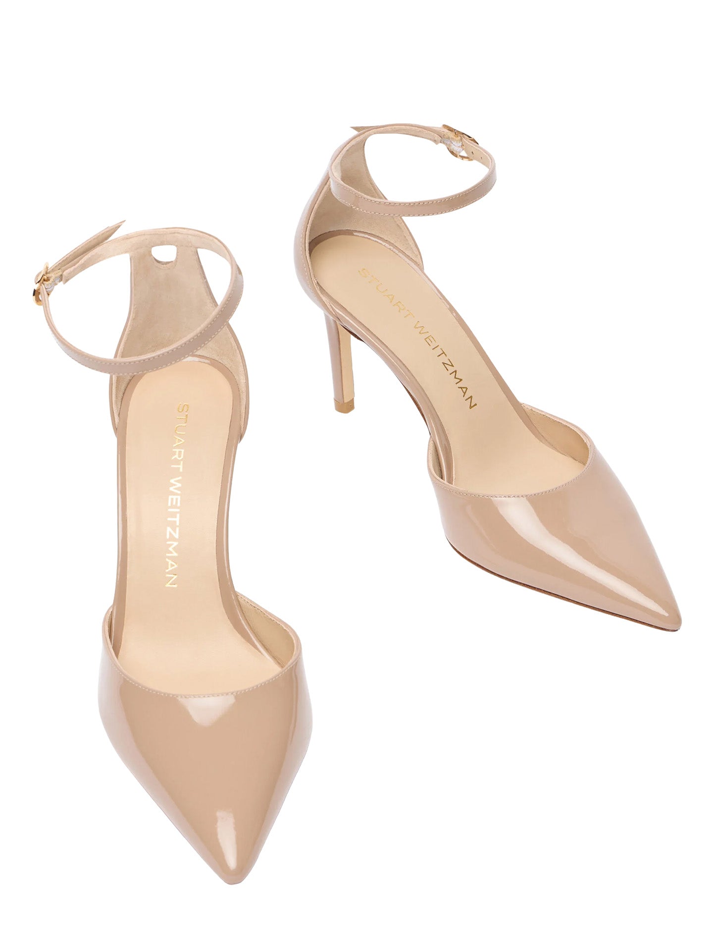Pair of beige high-heeled shoes on a white background