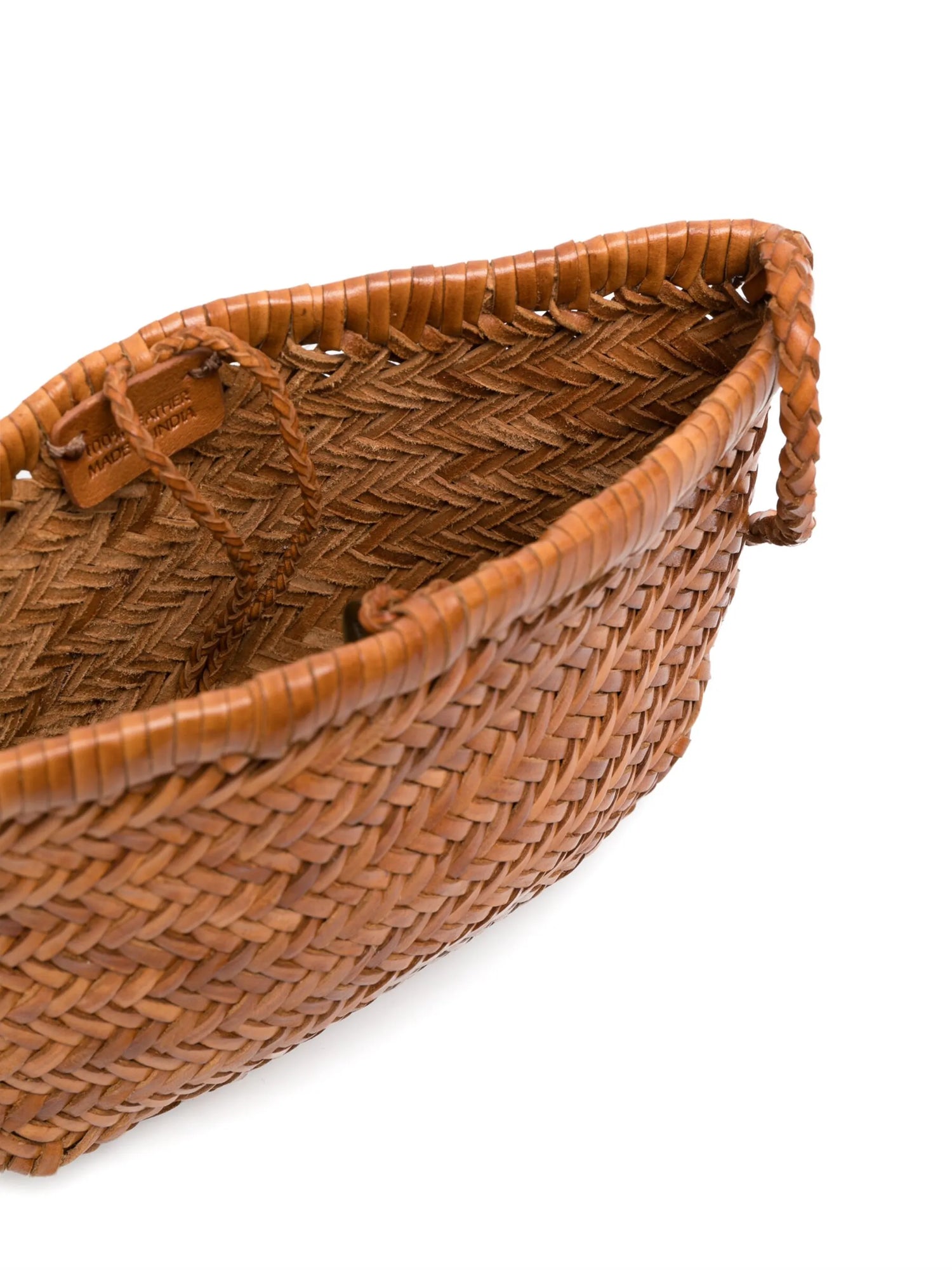 Woven brown leather bag on a white background