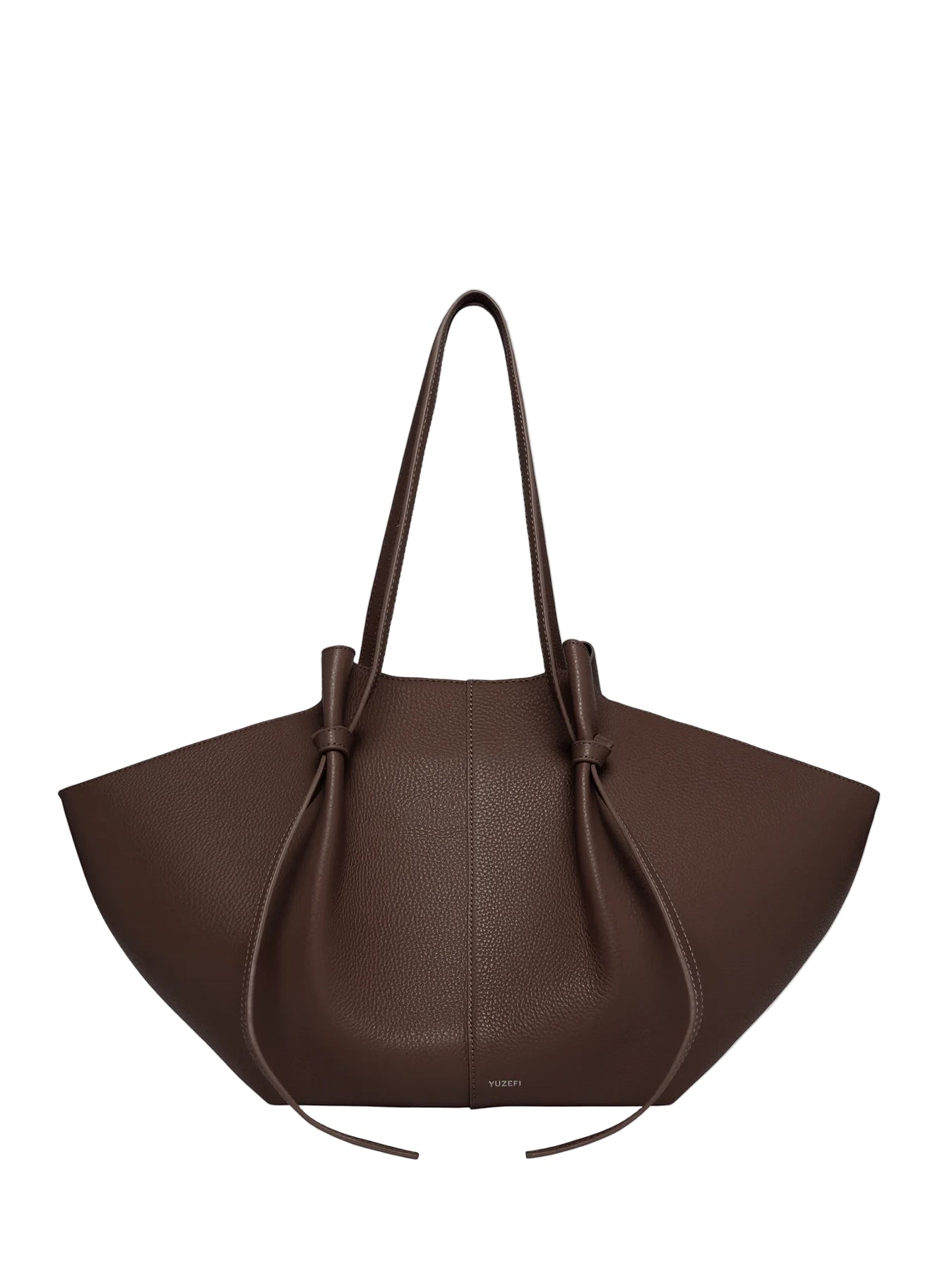 Yuzefi's brown leather handbag with a bow detail on a light gray background