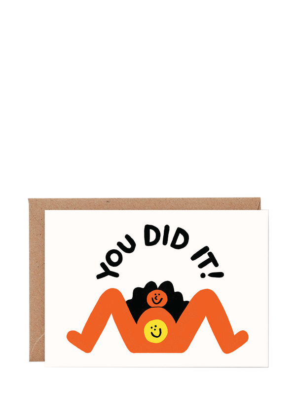A colorful greeting card with a cheerful illustration of a person and a smiling face representing the birth of a baby, with the text 'YOU DID IT!' written above.