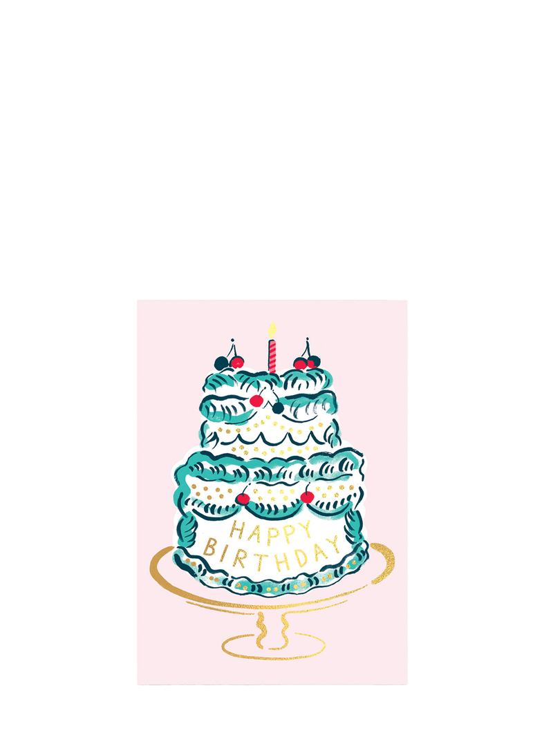 A greeting card featuring an illustration of a multi-layered birthday cake with cherries on top and gold foil lettering, along with the text 'Happy Birthday' and a candle on the top tier.