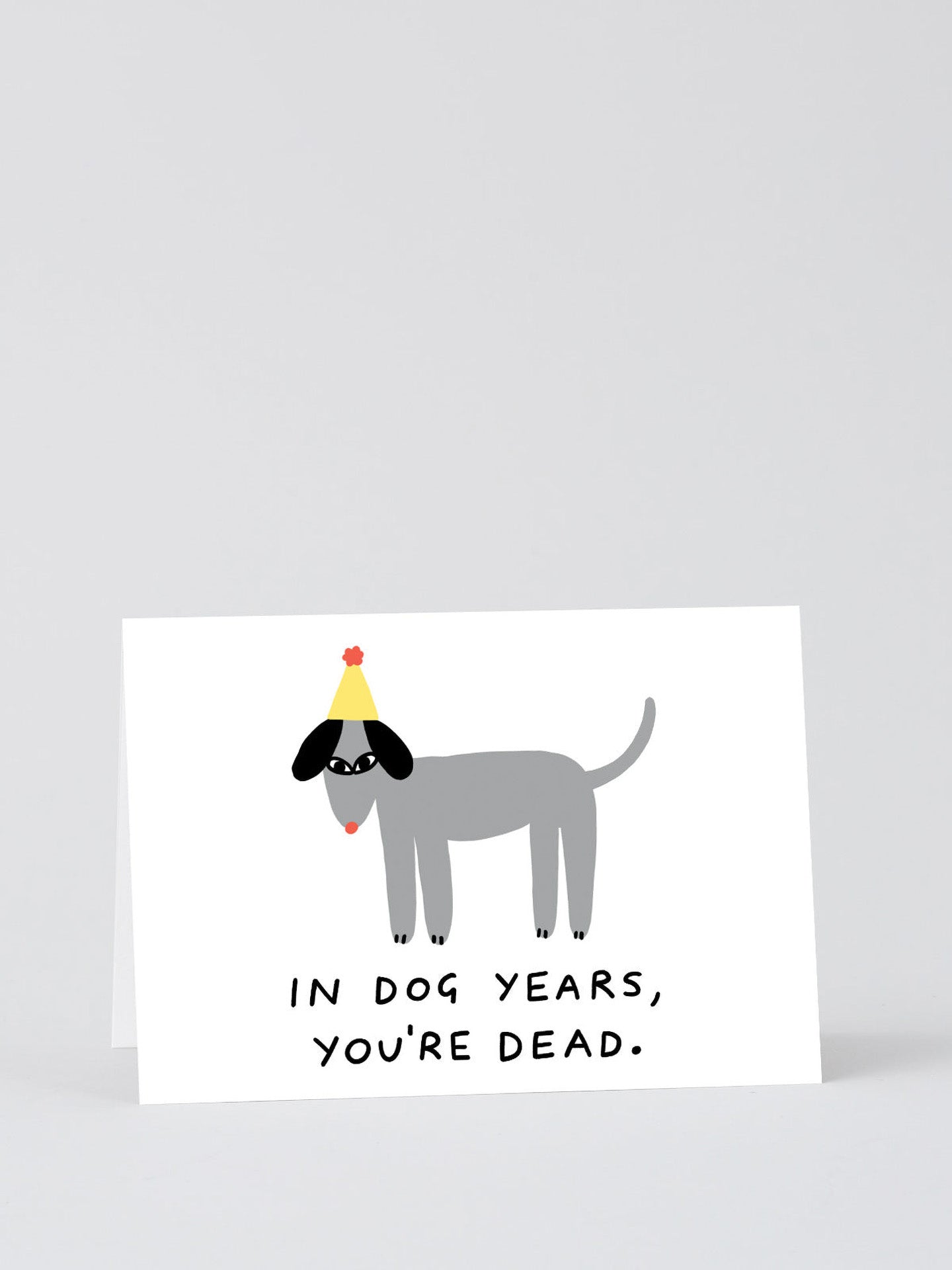 In Dog Years You're Dead party hat dog birthday card by Holly St Clair