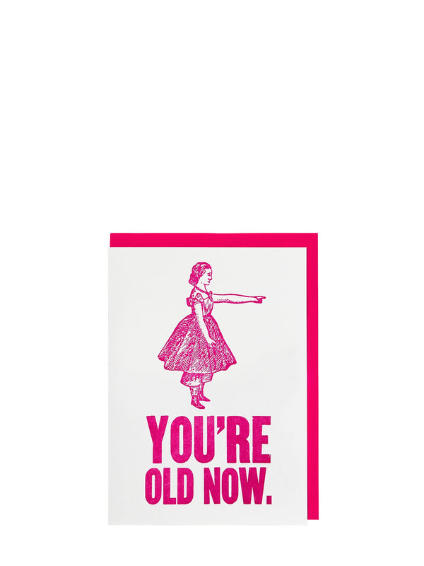 Illustration of a girl in a dress with text 'YOU'RE OLD NOW' in pink on a white background