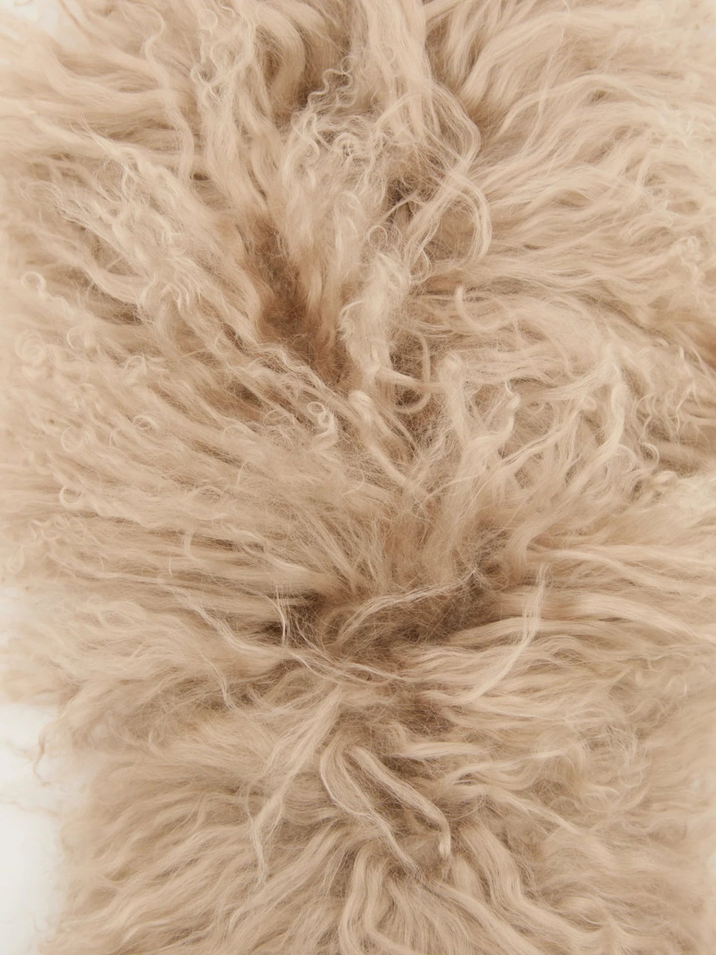 Close-up of beige fluffy lambwool scarf