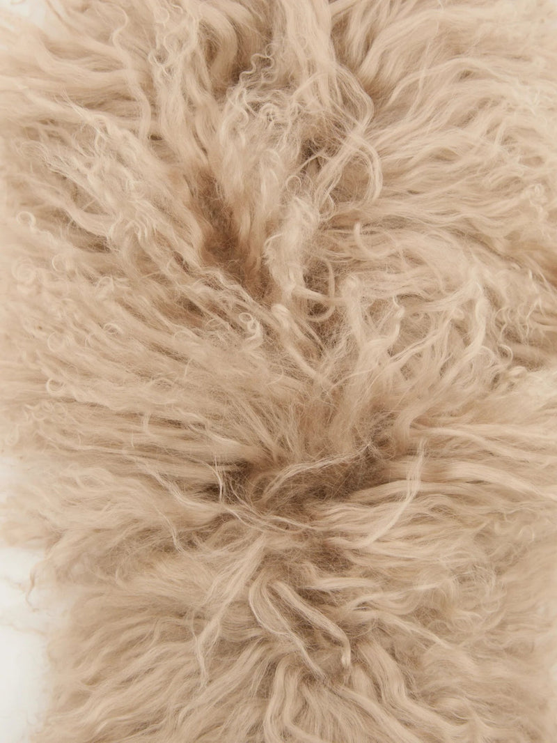 Close-up of beige fluffy lambwool scarf