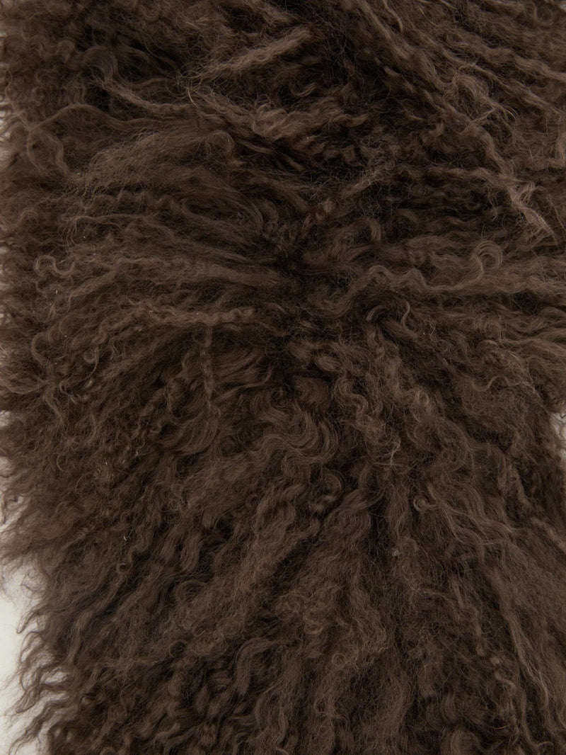 Close-up of brown, curly lamb hair texture scarf